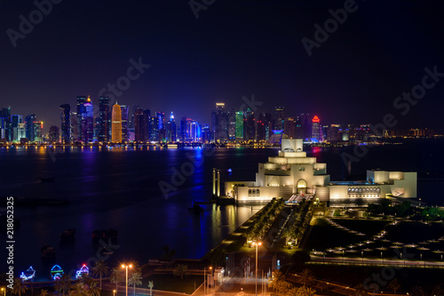 Doha Qatar night skyline panorama with Museum of Islamic Arts