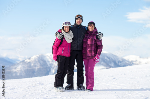 People enjoying winter holiday in ski resort