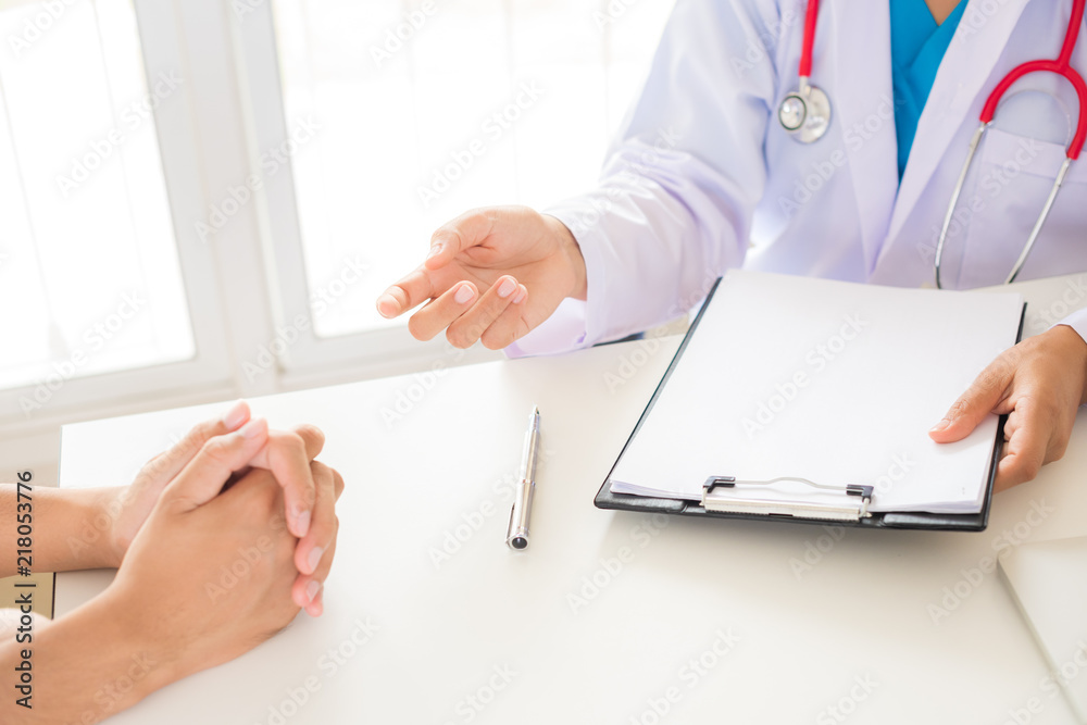 Doctor is explaining to her patient. Medicine and health care concept. Doctor and patient. Doctor is explaining to her patient. Medicine and health care concept. Doctor and patient.