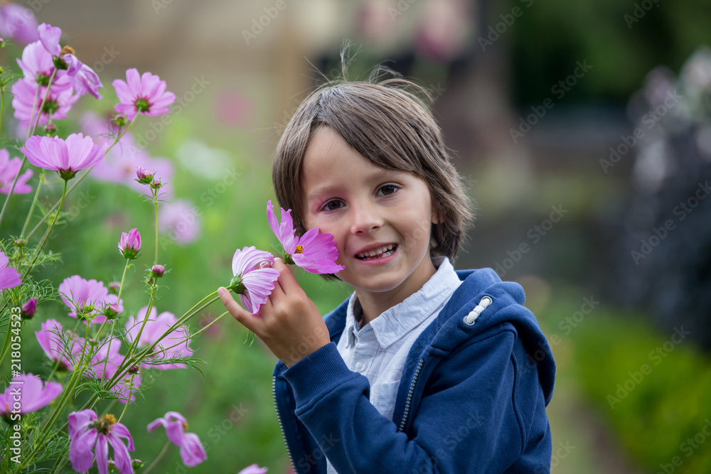 Beautiful child in amazing flower garden Beautiful child in amazing flower garden