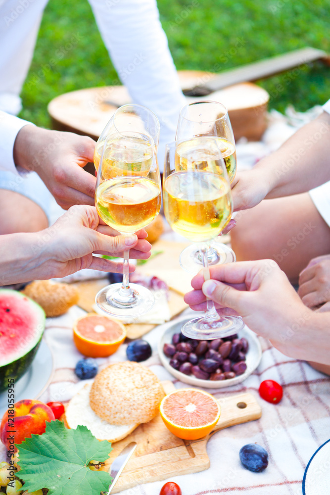 Summer Picnic Basket on the Green Grass. Food and drink concept. Friends Party time Summer Picnic Basket on the Green Grass. Food and drink concept. Friends Party time