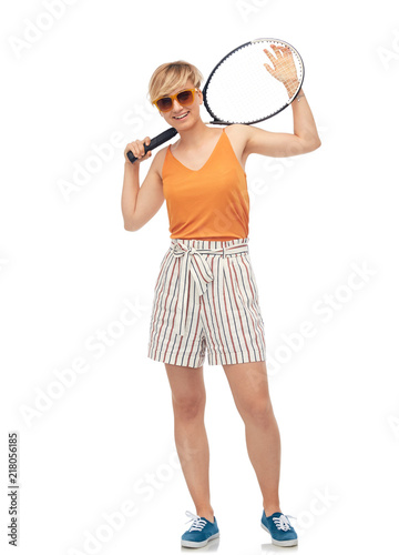 sport, leisure and people concept - smiling teenage girl with tennis racket over white background © Syda Productions