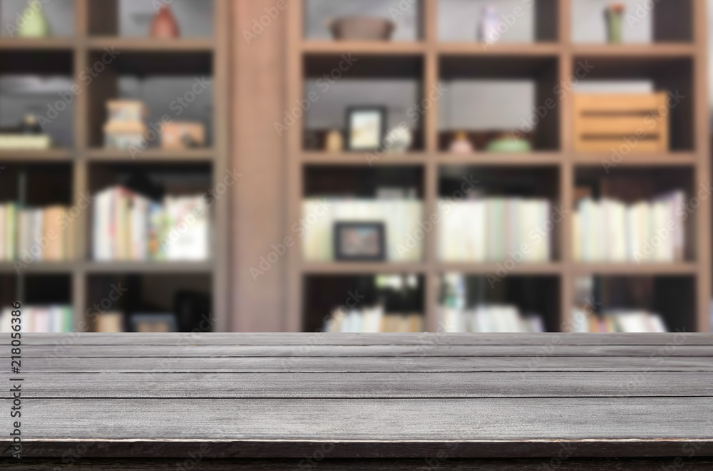 Wooden board empty table space platform in front of blurred library Of The background - can be used for display or montage your products. Mock up for display of product. Wooden board empty table space platform in front of blurred library Of The background - can be used for display or montage your products. Mock up for display of product.