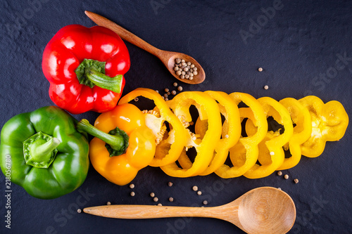 Three sweet peppers on a wooden background, Cooking vegetable salad