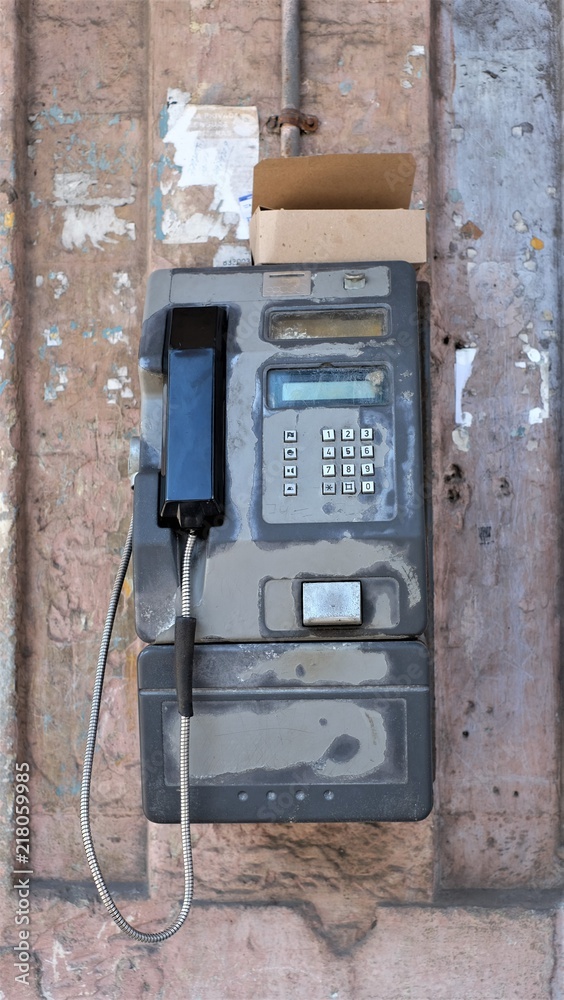 An old telephone on the street of Havana city, Cuba An old telephone on the street of Havana city, Cuba