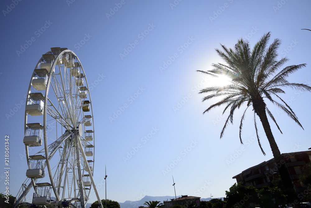 white ferris wheel at sunset