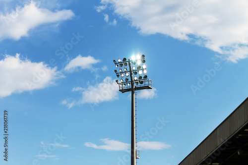 Soccer stadium lights over cloudy sky