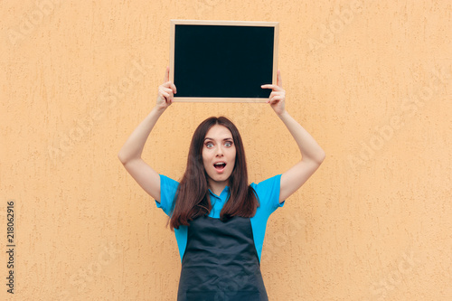 Female Employee Wearing Uniform Apron Holding Blackboard Sign 