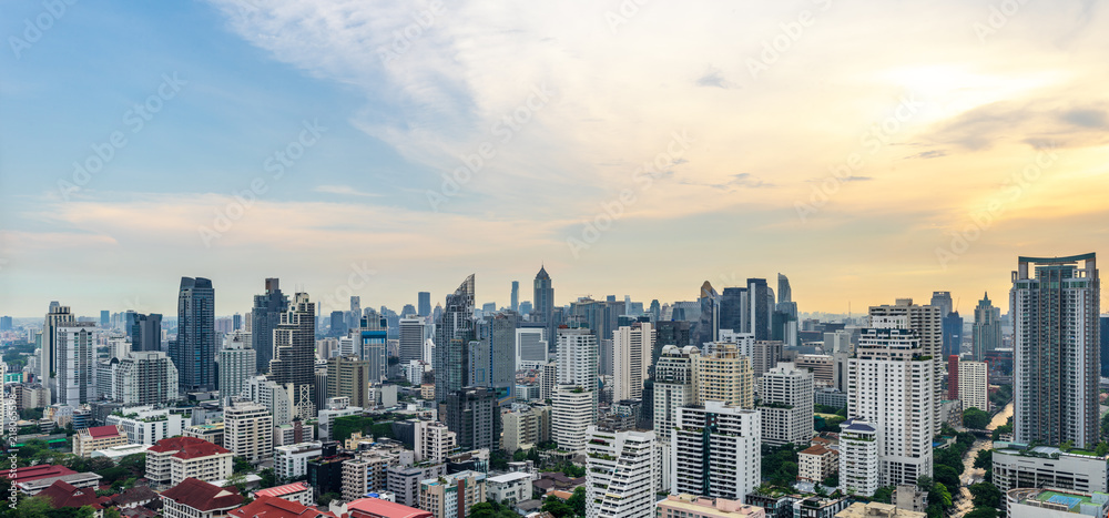 Fototapeta premium urban cityscape on evening sky and sun light
