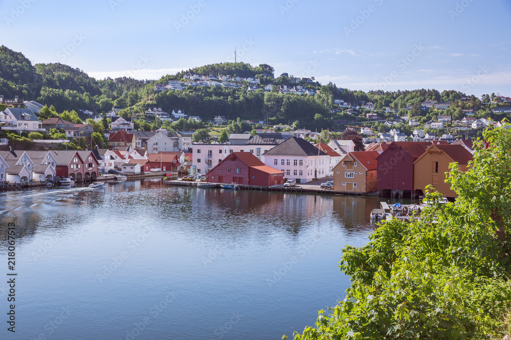 Vacation houses and boat houses at the waterfront in Flekkefjord