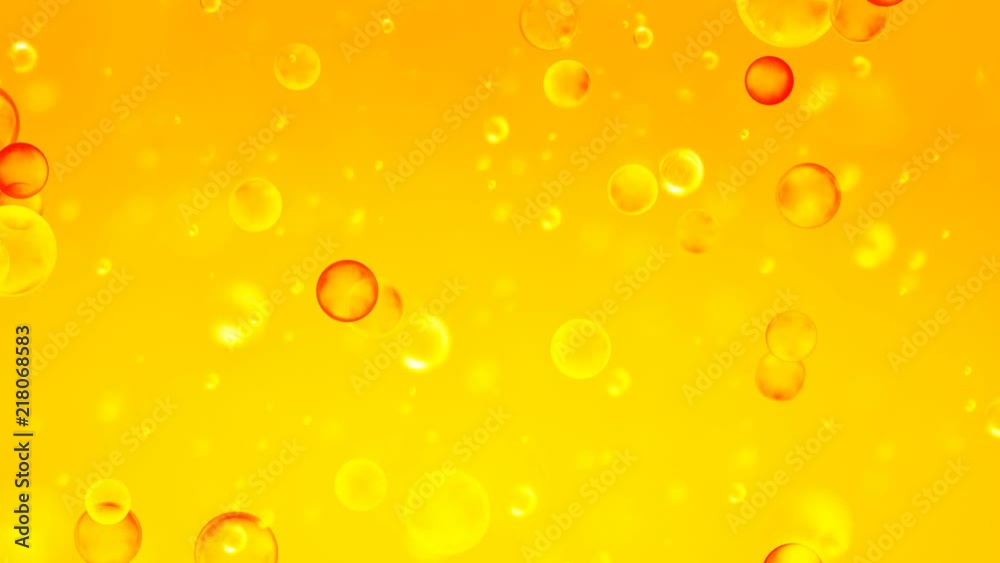 Golden orange bubbles rise upwards. Golden background with bubbles inside gold liquid for the project, oil, honey, beer, juice or other variants.
