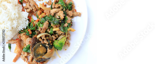 Stir-fried basil leave with minced pork, chicken, fried preserved egg and carrot, yellow corn, Broccoli with rice and fried egg in white dish on white background. Thai style food.