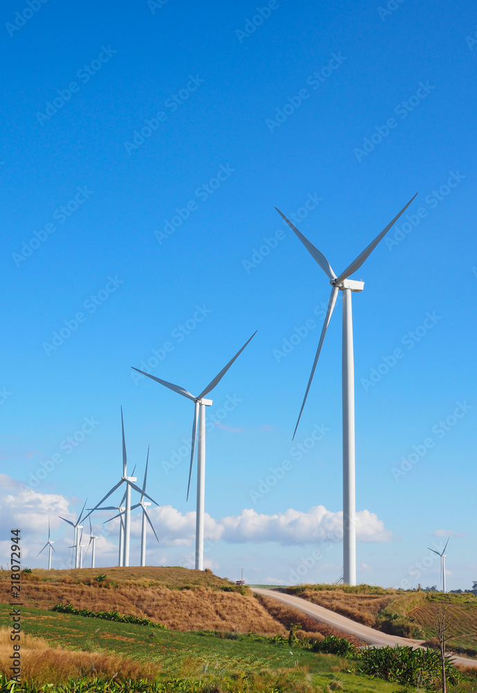 Wind turbine renewable energy source summer landscape with blue sky in natural landscapes Wind turbine renewable energy source summer landscape with blue sky in natural landscapes