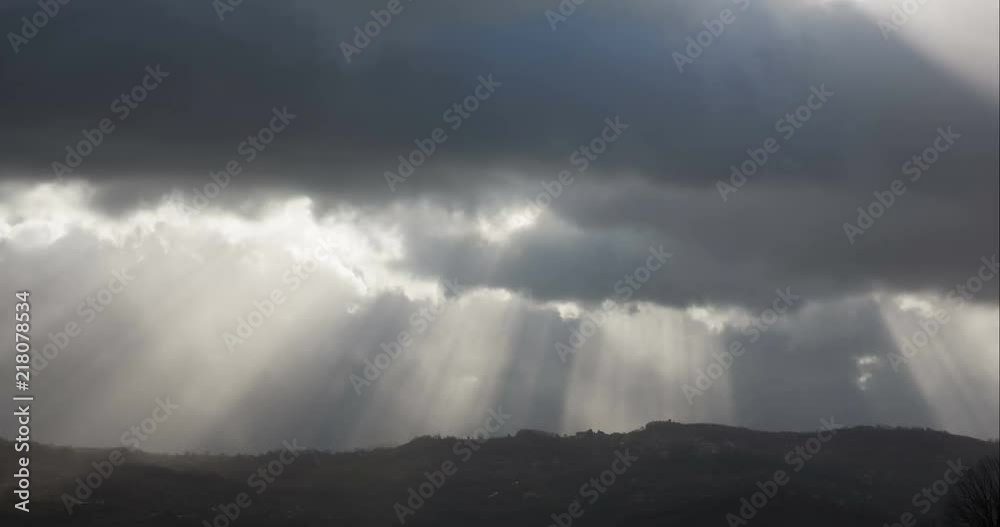 The calm after the storm, rays of sun quickly transpire through the clouds The calm after the storm, rays of sun quickly transpire through the clouds