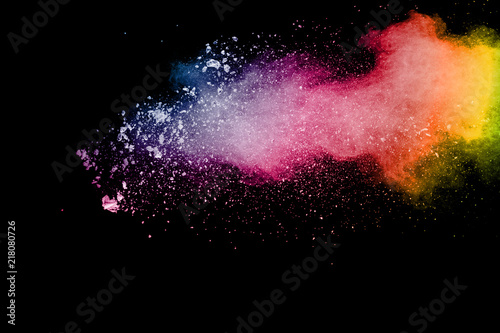 Color powder explosion.Colorful dust splash isolated on black background.