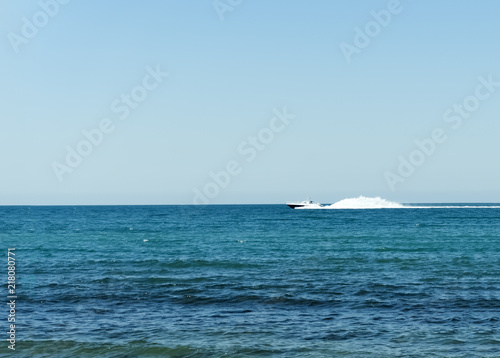 Coastguard white speed yacht in open waters