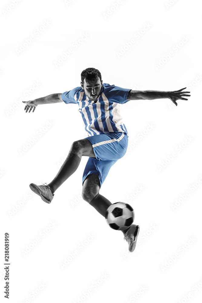 Professional football soccer player with ball isolated on white studio background