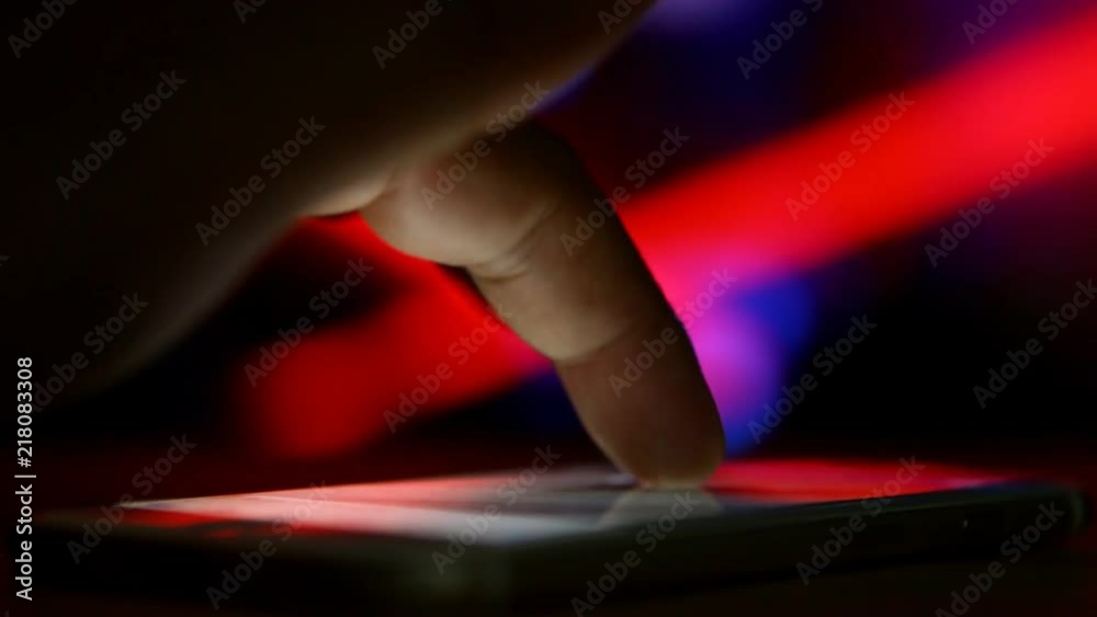 Man touching smartphone by finger Man touching smartphone by finger