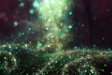 Abstract and magical image of glitter Firefly flying in the night forest. Fairy tale concept.
