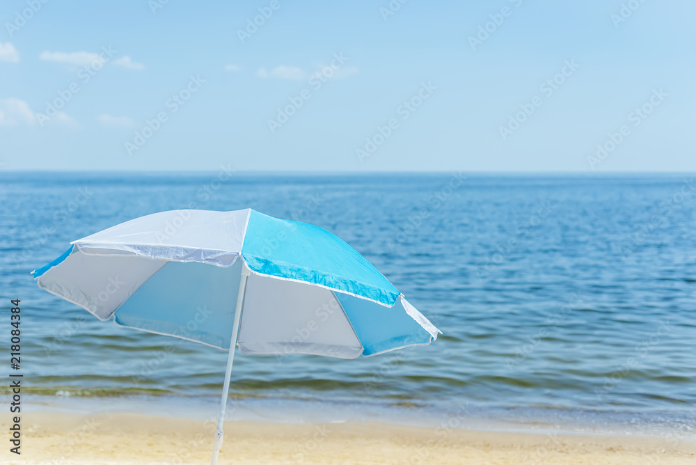 umbrella on sand beach and sea background. soft focus