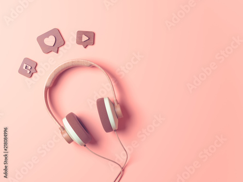 Vintage wooden Headphone with Pin heart, sound, song, play, recording. Overhead view of Traveler's accessories, Flat lay photography of Travel concept. Pink isolated background. 3d render