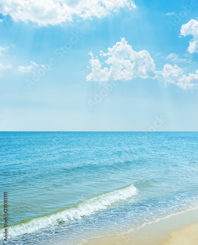 blue sky with clouds over sea and sand beach
