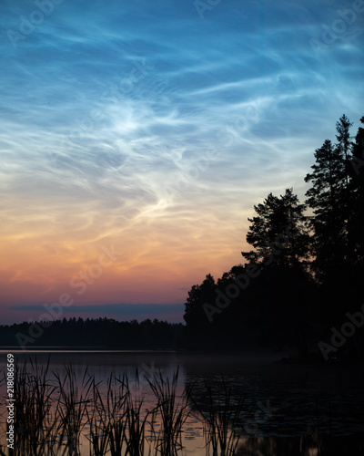 Night shining clouds over lake in Finland © Juhku