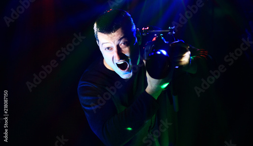 photographer-videographer at a disco with a camera