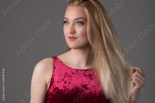 Blond model in red dress