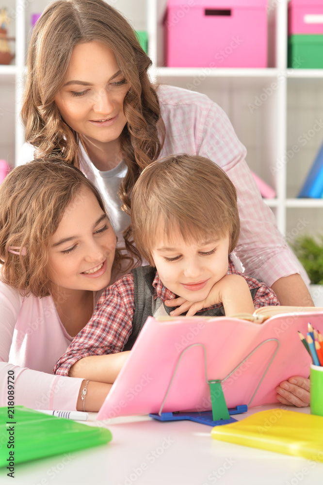 Portrait of a mother helping with homework Portrait of a mother helping with homework