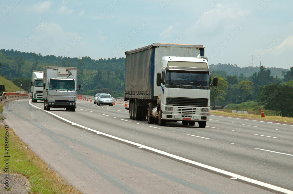 no brand trucks and no brand passenger cars on four lane roadway no brand trucks and no brand passenger cars on four lane roadway