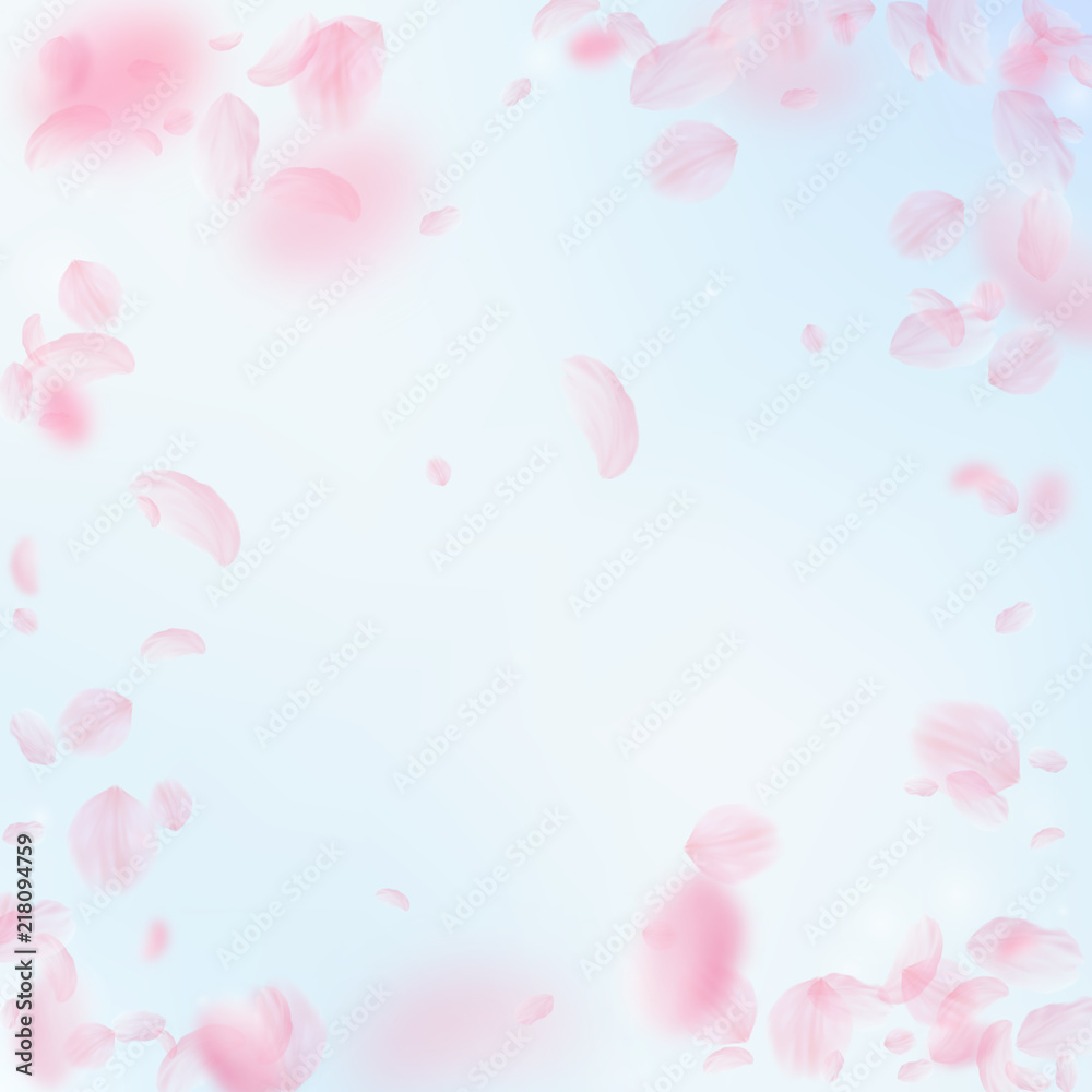 Sakura petals falling down. Romantic pink flowers vignette. Flying petals on blue sky square backgro