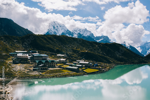 Mountain range with beautiful clouds. Mountain landscape. View on the lake Gokyo Ri. Blue sky with clouds. Himalaya mountains of Nepal, snow covered high peaks and lake not far from Everest.