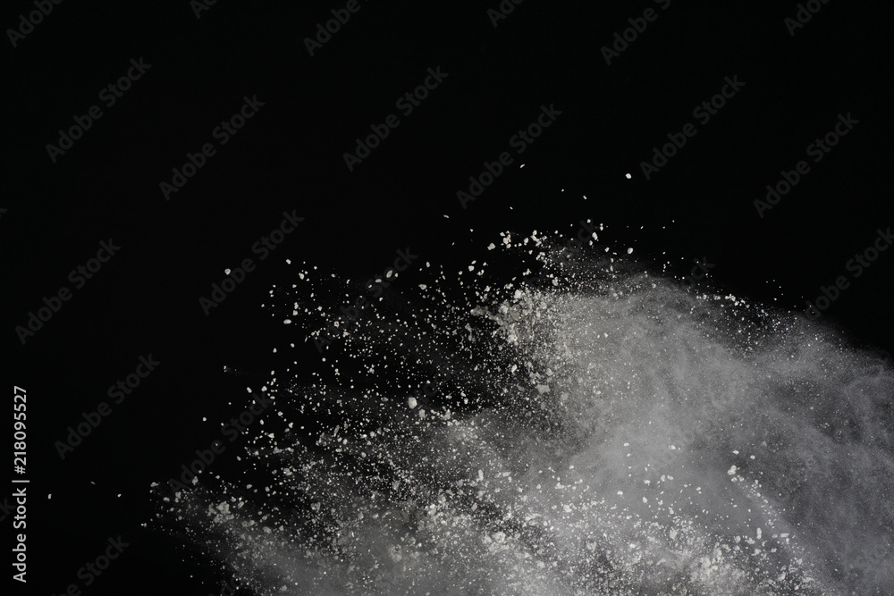 White powder explosion isolated on black background. Colored dust splatted. White powder explosion isolated on black background. Colored dust splatted.