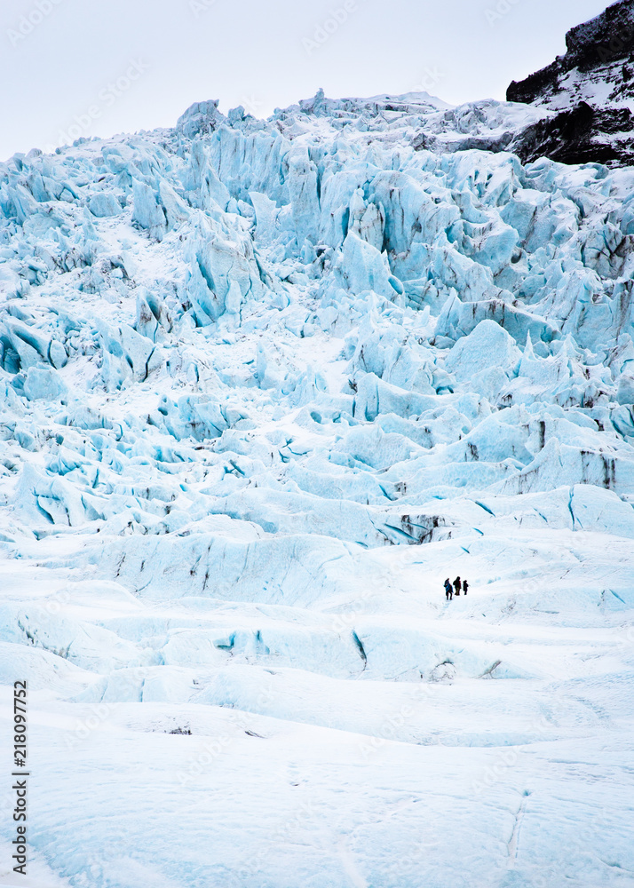Distant glacier trekking party Distant glacier trekking party