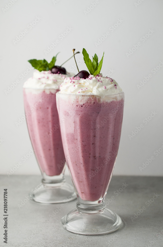 Cherry milkshake with whipped cream and cherries Cherry milkshake with whipped cream and cherries