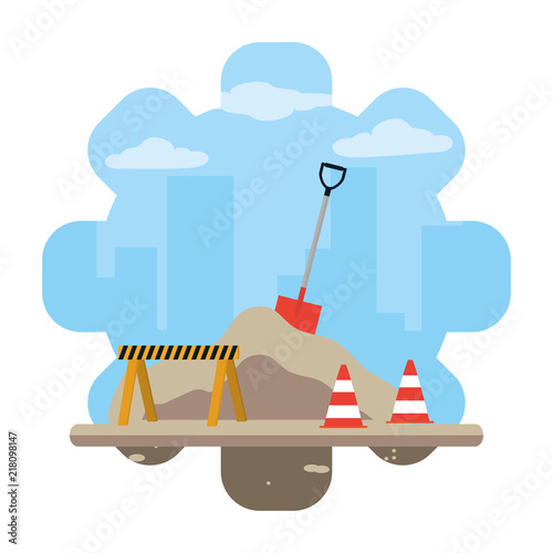 construction equipment with traffic cones and caution sign