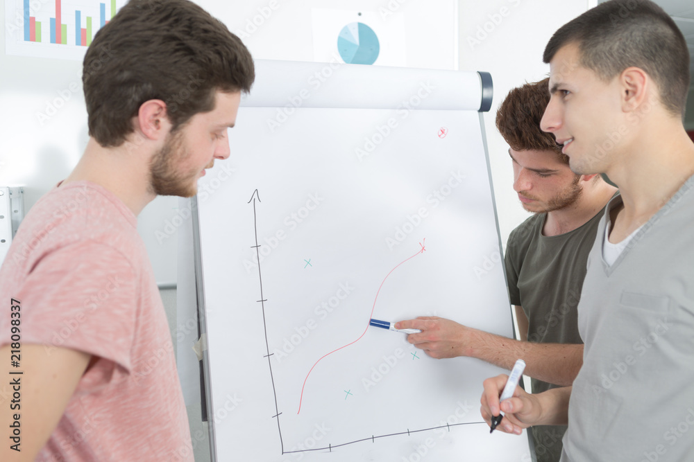 students brainstorming on meeting at office students brainstorming on meeting at office