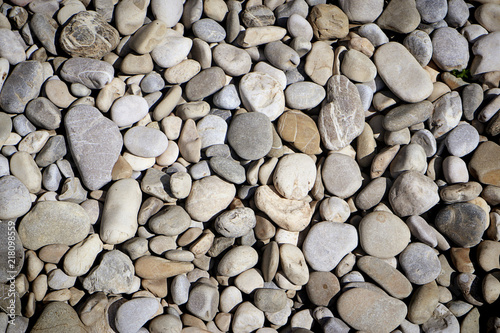 nature background : pebbles texture, rounded stone smoothed by river water