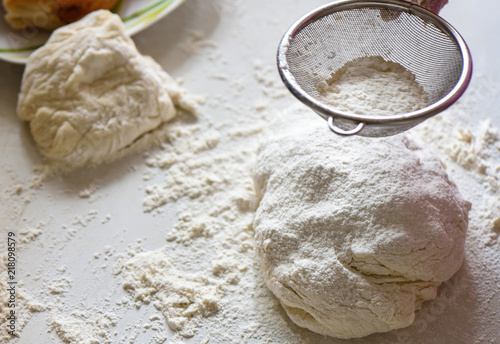 Wheat flour sprinkled on the dough homemade