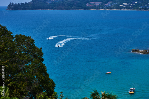 Beautiful sea landscape with tropical coast and the high-speed boats. Boats in a beautiful bay.