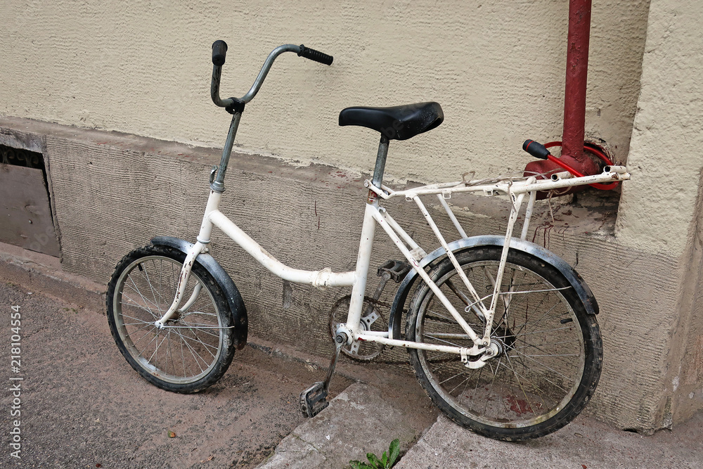 bicycle parked on the steps near the wall bicycle parked on the steps near the wall