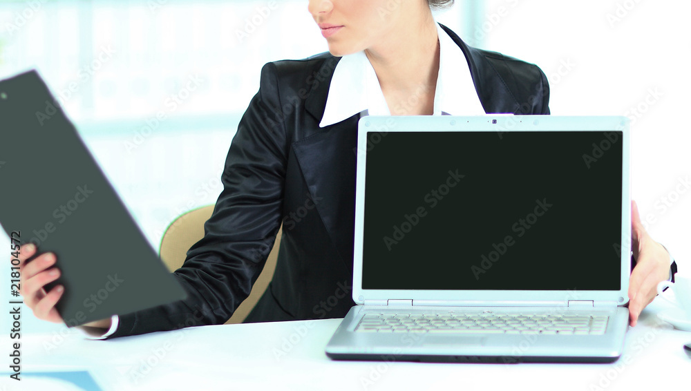 Presentation of the laptop, business woman, looking at the work plan, in office. Presentation of the laptop, business woman, looking at the work plan, in office.