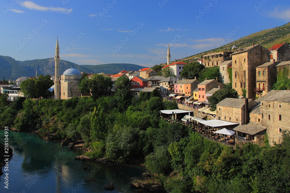 Mostar in Bosnia and Herzegovina - landscape with the Neretva River and Mosque of Koski Mehmed Pasha seen from the Old Bridge.