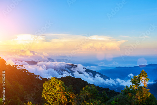 Nature. Сolorful sunrise. Mountains during sunrise. Beautiful natural landscape in the summer time. Mountains under mist in the early morning. Bright morning sunlight. Natural background. Landscape. © eskstock