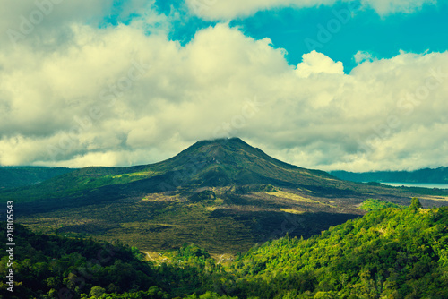 Beautiful banner with mountain landscape and tropical forest. Landscape of Batur volcano on Bali island  Indonesia. View far away beauty  inspiring mountain. Summer day. Instagram filter photo.