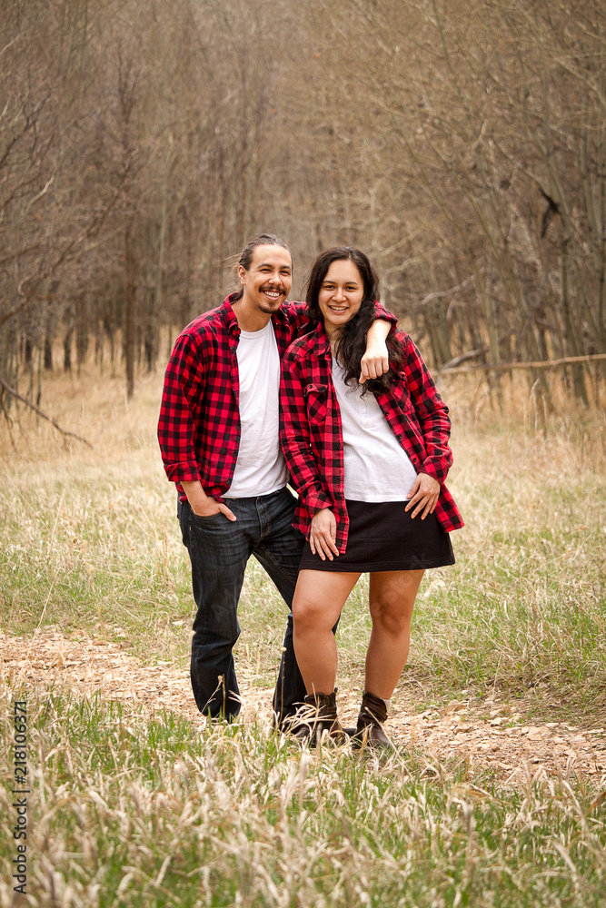 Mixed race asian couple in red flannel shirts hiking Stock Photo | Adobe  Stock