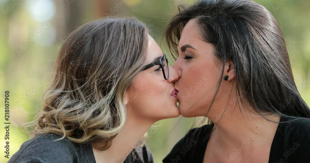 LGBT lesbian couple kiss. real life Girlfriends kissing each other Stock ビデオ | Adobe Stock