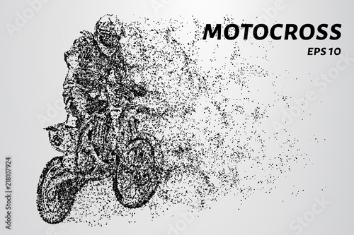 Motocross particles. A motorcyclist performs stunts