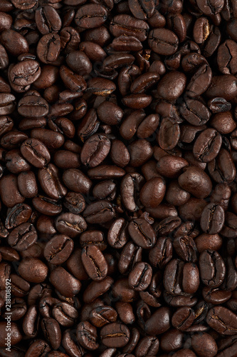 Texture roasted coffee beans, can be used as a background. Brown coffee beans, close-up of coffee beans for background and texture